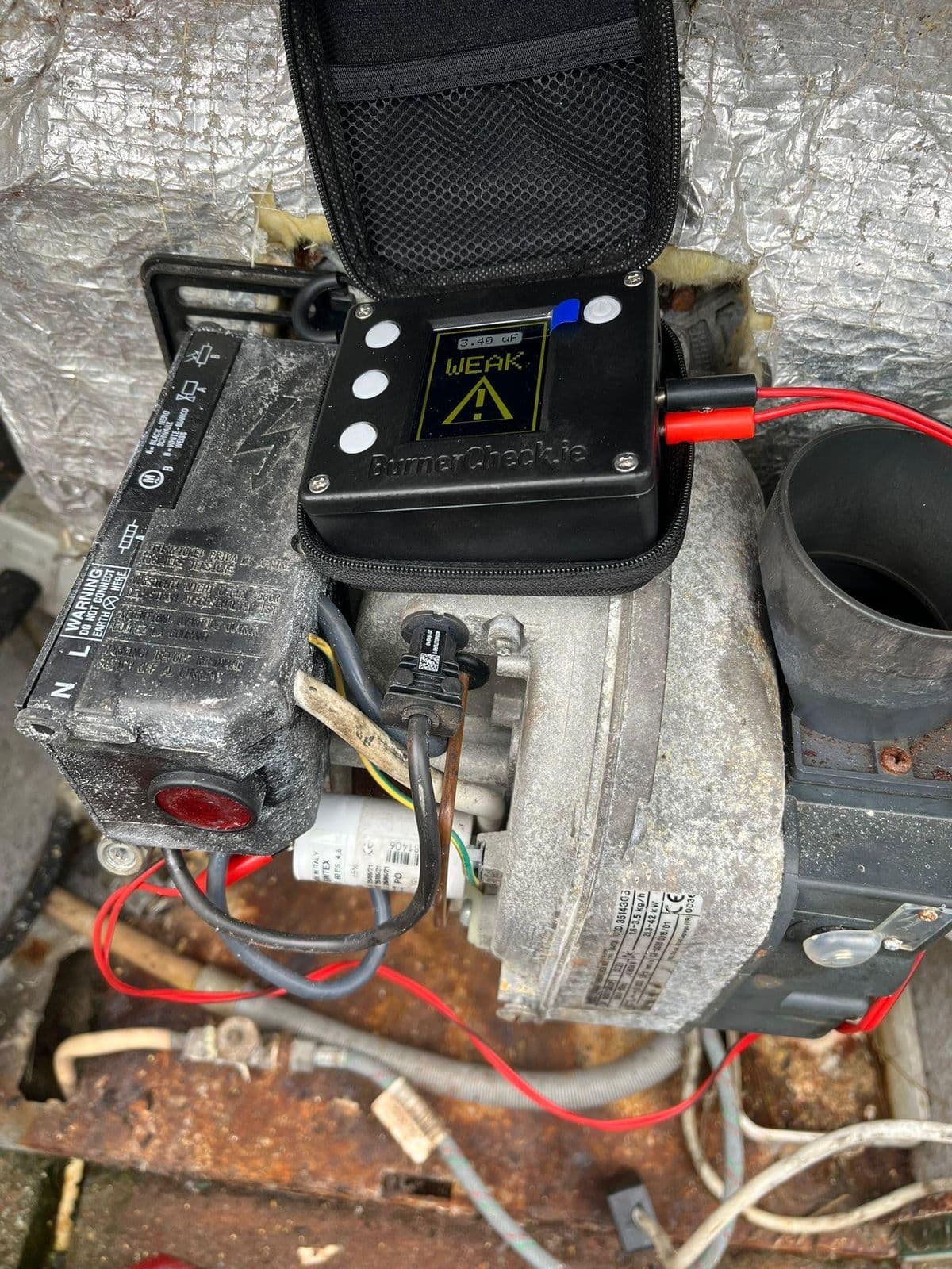 Capacitor test on a Grant G3 burner - weak reading flagged on screen