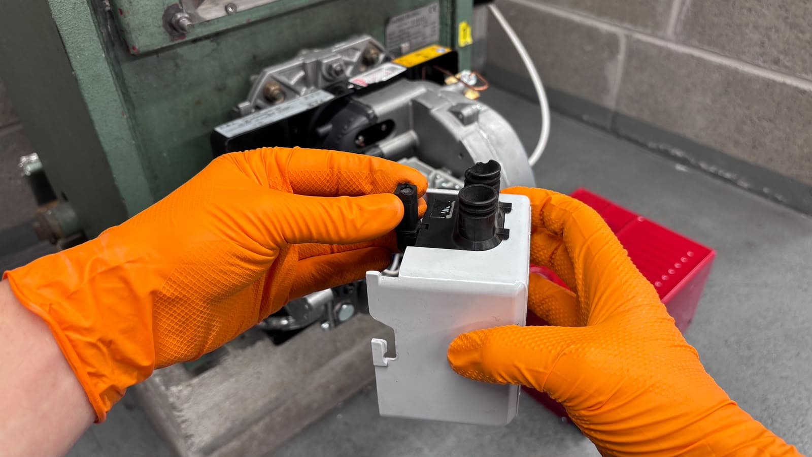 Step 3: Disconnect the photocell from the control box by pulling up and away.