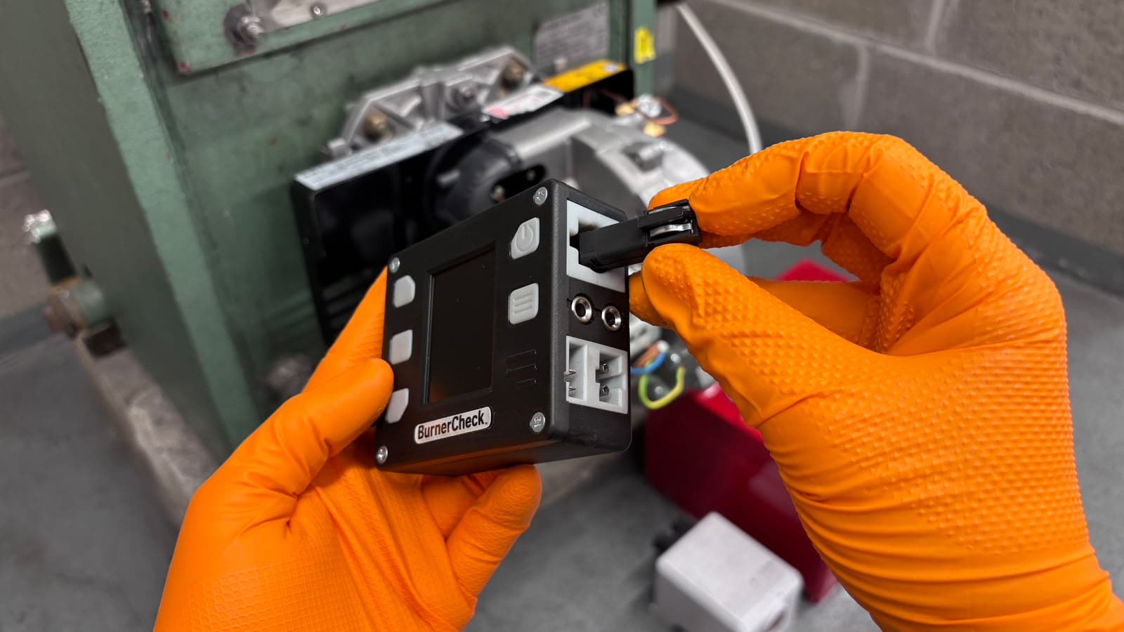 Step 4: Insert the photocell into the Photocell test port on the BurnerCheck, keeping the connecting pins uppermost.